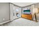 Bedroom with neutral paint, a modern dresser, and doors that lead to a small balcony at 1557 N College Ave # 3, Indianapolis, IN 46202