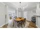 Stylish dining area featuring modern lighting, hardwood floors, and an open layout at 1557 N College Ave # 3, Indianapolis, IN 46202
