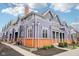 Charming townhome exterior with brick accents, manicured landscaping, and inviting architecture at 1557 N College Ave # 3, Indianapolis, IN 46202