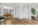 Open-concept living area featuring hardwood floors with an open view to the dining and kitchen area at 1557 N College Ave # 3, Indianapolis, IN 46202