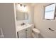 Modern bathroom with a white vanity, a large mirror, and a toilet at 1711 Ringgold Ave, Indianapolis, IN 46203