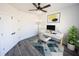 Home office featuring a modern desk, rolling chair, ceiling fan, and geometric rug at 1711 Ringgold Ave, Indianapolis, IN 46203