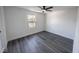 Bedroom with a window and wood floors at 1711 Ringgold Ave, Indianapolis, IN 46203
