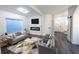 Modern living room with fireplace, gray sofa, contemporary decor, and plenty of natural light at 1711 Ringgold Ave, Indianapolis, IN 46203