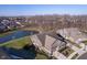 Overhead shot of a beautifully landscaped home with a serene pond in a peaceful neighborhood setting at 17346 Haxby Ln, Westfield, IN 46074