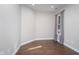 Bright, airy room with a single window dressed in sheer curtains, natural light and wood flooring at 17346 Haxby Ln, Westfield, IN 46074