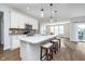 Gourmet kitchen features quartz countertops, stainless steel appliances, and a breakfast bar for casual dining at 17346 Haxby Ln, Westfield, IN 46074