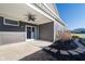 Covered back patio with ceiling fan, sliding glass door, and concrete flooring at 17346 Haxby Ln, Westfield, IN 46074