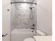This bathroom has a white bathtub with a marble tile backsplash and a black showerhead at 2053 Columbia Ave, Indianapolis, IN 46202