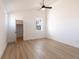 Bright bedroom featuring vaulted ceiling, a closet, wood-look flooring, and white trim at 2053 Columbia Ave, Indianapolis, IN 46202