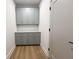 This hallway features lots of cabinet space and wood floors at 2053 Columbia Ave, Indianapolis, IN 46202