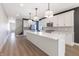 Spacious kitchen with a large island, pendant lighting, and modern appliances at 2053 Columbia Ave, Indianapolis, IN 46202