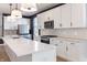 Spacious kitchen with a large island, pendant lighting, and modern appliances at 2053 Columbia Ave, Indianapolis, IN 46202