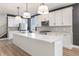 Spacious kitchen with a large island, pendant lighting, and modern appliances at 2053 Columbia Ave, Indianapolis, IN 46202