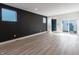 Open concept living room featuring hardwood floors, recessed lighting, and black accent wall at 2053 Columbia Ave, Indianapolis, IN 46202