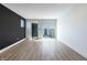 Spacious open concept living room with hardwood floors, recessed lighting, and sliding glass door at 2053 Columbia Ave, Indianapolis, IN 46202