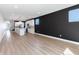 Spacious open concept living room connects to the kitchen and features hardwood floors at 2053 Columbia Ave, Indianapolis, IN 46202