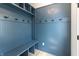 Charming mudroom features custom blue built-ins, hooks, and bench seating at 2053 Columbia Ave, Indianapolis, IN 46202