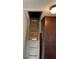 Attic access via wooden ladder with original wood trim at 212 Walnut St, Greenfield, IN 46140