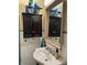 Bathroom with sink, mirror, and cabinet at 212 Walnut St, Greenfield, IN 46140