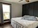 Bedroom with window and paneled accent wall at 212 Walnut St, Greenfield, IN 46140