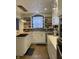 Updated kitchen with white cabinets, stainless steel appliances, and decorative backsplash at 212 Walnut St, Greenfield, IN 46140