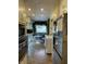 Bright kitchen with breakfast nook, modern appliances, and custom cabinetry at 212 Walnut St, Greenfield, IN 46140
