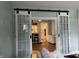 Spacious living room entrance with unique sliding glass doors at 212 Walnut St, Greenfield, IN 46140