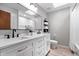 Bathroom featuring a double vanity, large mirror, recessed lighting, shelving, and bathtub with curtain at 24 Thornhurst Dr, Carmel, IN 46032