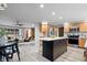 Open-concept kitchen and living room layout with modern finishes and stainless steel appliances at 24 Thornhurst Dr, Carmel, IN 46032