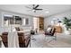 Cozy living room with modern furniture, neutral colors, and a sleek ceiling fan at 24 Thornhurst Dr, Carmel, IN 46032