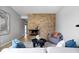 Inviting living room showcasing a stone fireplace, modern decor, and comfortable seating at 24 Thornhurst Dr, Carmel, IN 46032