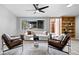 Stylish living room featuring a white sofa, leather chairs, and plenty of natural light at 24 Thornhurst Dr, Carmel, IN 46032