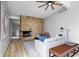 Bright living room showcasing a stone fireplace, modern decor, and comfortable seating at 24 Thornhurst Dr, Carmel, IN 46032