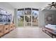 Bright living room with large windows, sleek furniture, wood floors and modern decor at 24 Thornhurst Dr, Carmel, IN 46032