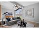 Cozy living room featuring a gray sofa, lots of natural light, and modern decor at 24 Thornhurst Dr, Carmel, IN 46032