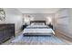 Bright main bedroom with wood floors and modern decor at 24 Thornhurst Dr, Carmel, IN 46032