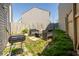 Cozy backyard featuring a patio set, grill, and partially fenced yard for outdoor enjoyment at 2421 Grand Fir Dr, Greenwood, IN 46143