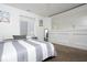 Bedroom features a black dresser, a mirror, and a large window at 2421 Grand Fir Dr, Greenwood, IN 46143