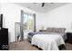 Well-lit bedroom boasts soft carpeting, large window, and minimalist decor at 2421 Grand Fir Dr, Greenwood, IN 46143