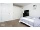 Comfortable bedroom with carpet flooring, large closet, and neutral paint at 2421 Grand Fir Dr, Greenwood, IN 46143