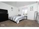 Bedroom features a black dresser, a mirror, and a large window at 2421 Grand Fir Dr, Greenwood, IN 46143