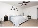Bright bedroom featuring ceiling fan, carpet floor, simple decorations, and side tables at 2421 Grand Fir Dr, Greenwood, IN 46143