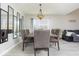 Dining room featuring a modern table and chairs, stylish mirrors, and an open floor plan at 2421 Grand Fir Dr, Greenwood, IN 46143