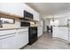 Efficient kitchen design with modern appliances, white cabinetry, and sleek countertops at 2421 Grand Fir Dr, Greenwood, IN 46143