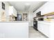 Efficient kitchen design with modern appliances, white cabinetry, and sleek countertops at 2421 Grand Fir Dr, Greenwood, IN 46143