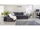 Well-lit living room showcasing a comfortable sofa, stylish rug, and modern decor at 2421 Grand Fir Dr, Greenwood, IN 46143