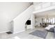 View of an open-concept floor plan with stairs and a living room flowing into a dining area at 2421 Grand Fir Dr, Greenwood, IN 46143