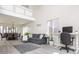 Bright living room featuring vaulted ceilings, modern decor, and an adjacent dining area at 2421 Grand Fir Dr, Greenwood, IN 46143