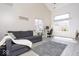 Bright living room featuring vaulted ceilings, modern decor, and a comfortable sofa at 2421 Grand Fir Dr, Greenwood, IN 46143